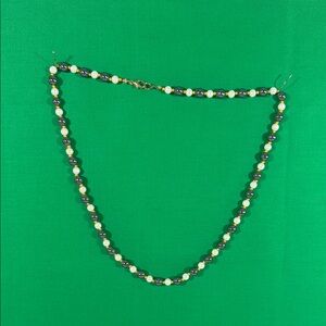 Elegant Black and White Beaded Gold Accented Necklace
